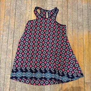 Floral Sleeveless Dress with Geometric Hem